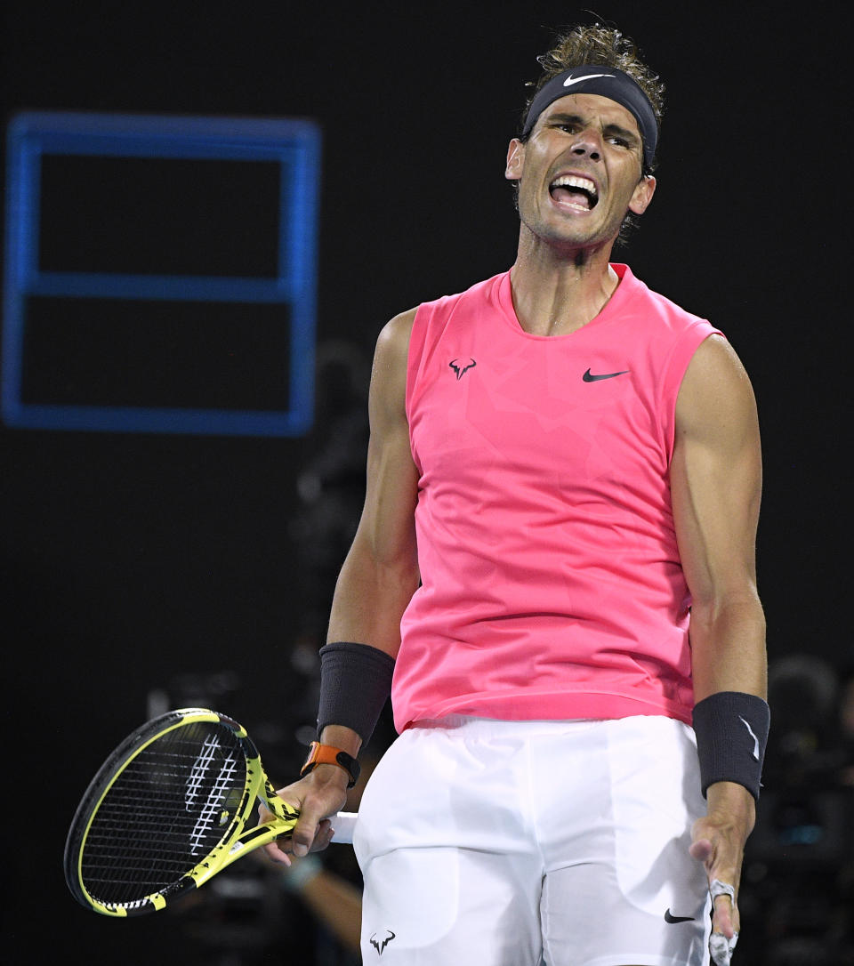 Spain's Rafael Nadal reacts after losing a point to Austria's Dominic Thiem during their quarterfinal match at the Australian Open tennis championship in Melbourne, Australia, Wednesday, Jan. 29, 2020. (AP Photo/Andy Brownbill)