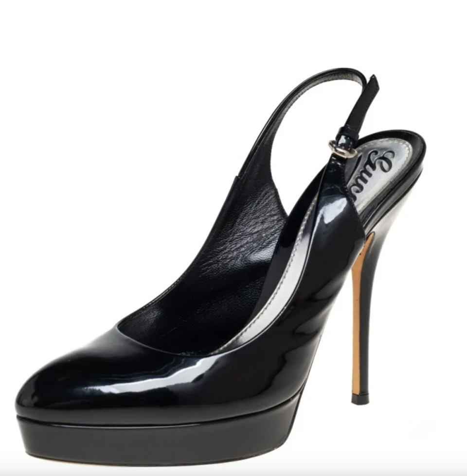 A product shot of the Gucci black patent leather stilettos