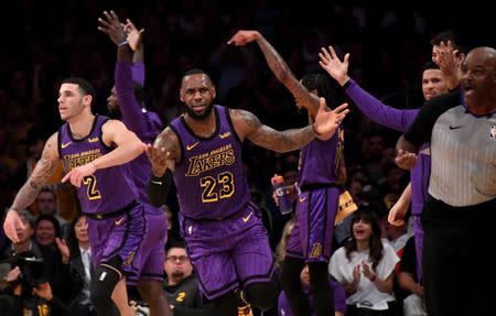 Nov 14, 2018; Los Angeles, CA, USA; Los Angeles Lakers forward LeBron James (23) reacts with members of the team against the Portland Trail Blazers during the second half at Staples Center. Kirby Lee-USA TODAY Sports