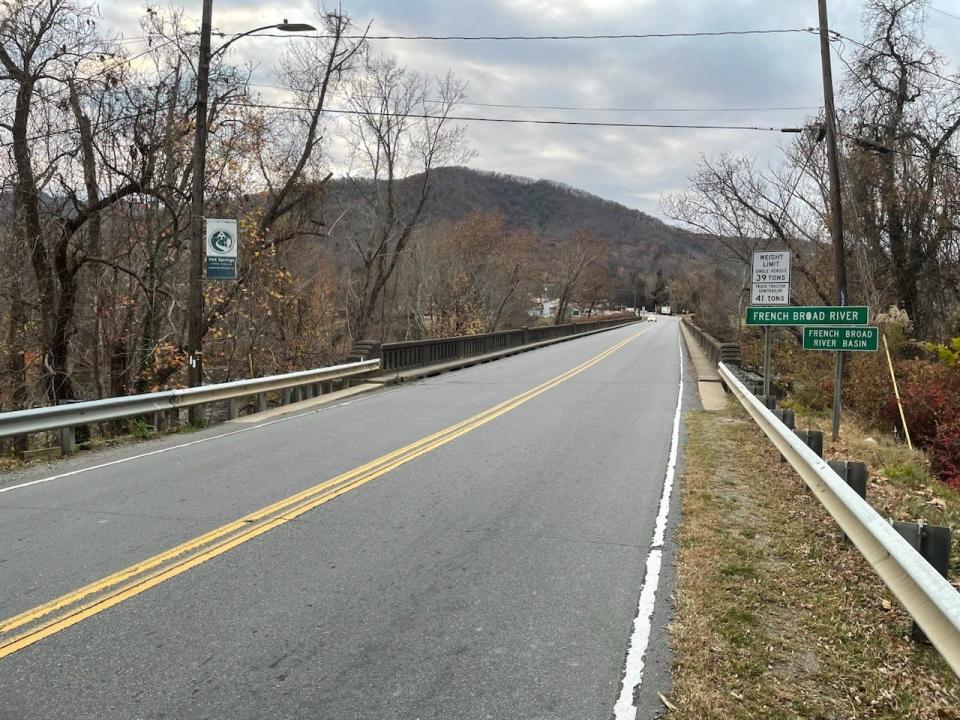 Nantahala Outdoors Center's parking lot is one of the only access points for the French Broad River in Hot Springs, and sits below the portion of the bridge pictured here. The bridge will be rebuilt beginning in October 2024.