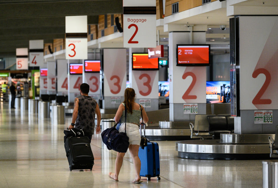 Passengers in an usually quiet baggage arrivals area at Sydney Domestic Airport. Source: AAP