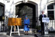 Britain's Queen Elizabeth listens to GCHQ Director Jeremy Fleming as she visits Watergate House to mark the centenary of the GCHQ (Government Communications Head Quarters) in London, Britain, February 14, 2019. REUTERS/Hannah McKay/Pool