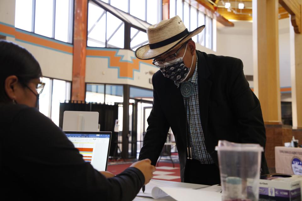 Titus J. Nez listens to instructions while filing his candidacy form on May 4 for the Navajo Nation Council to represent Church Rock, Iyanbito, Mariano Lake, Pinedale, Smith Lake and Thoreau chapters.