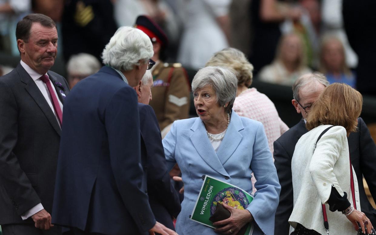 Theresa May, the former prime minister, is pictured today in the Royal Box at the Wimbledon tennis tournament