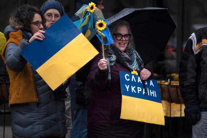 Protesters wave signs and flags in support of Ukraine by New Hope-Lambertville bridge in Lambertville on Wednesday, March 9, 2022. Several New Hope and Lambertville organizations came together to stand in solidarity with Ukrainian people.