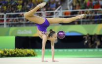 <p>Sabina Ashirbayeva (KAZ) of Kazakhstan competes using the ball. (Reuters) </p>