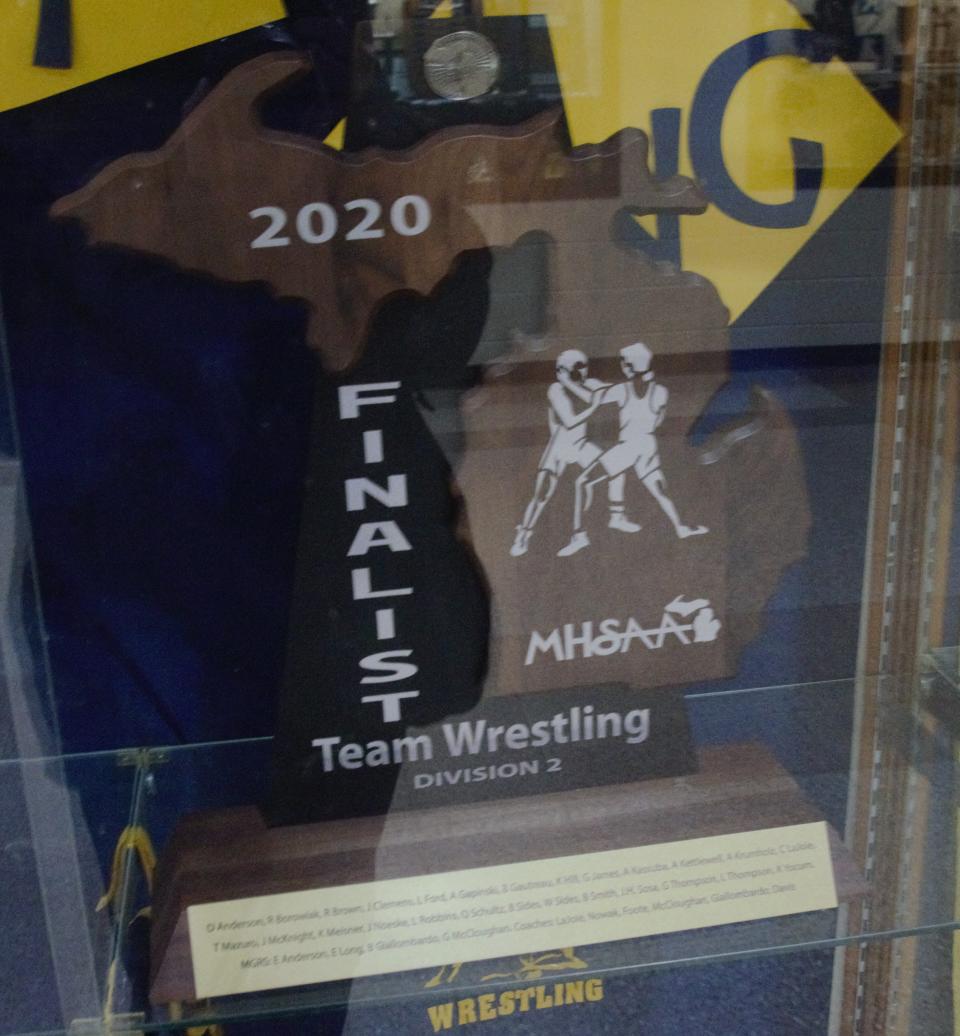 The trophy from the 2020 Division 2 state final runner-up wrestling team sits in the trophy case at Gaylord High School.