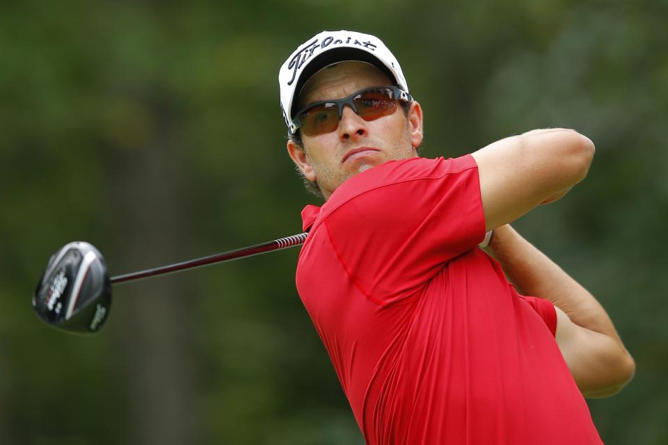 Scott of Australia tees off on the first hole during the Deutsche Bank Championship golf tournament in Norton