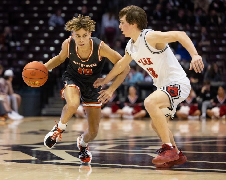 Republic’s Ahlante Askew drives around Ozark’s Colton Ballard during the semifinal round of the gold division at the Blue and Gold Tournament on December 29, 2021.