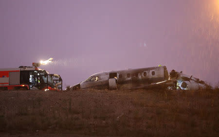 A fire truck is seen next to the wreckage of a private jet after it crashed at Ataturk airport in Istanbul, Turkey, September 21, 2017. REUTERS/Osman Orsal