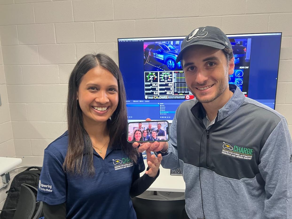 Matteo Pizzuto (right) and  Bipana KC, and the CHARGE lab team from the University of Windsor. Many members of the team are currently in Germany demonstrating a remote driving simulator.  (Jacob Barker/CBC - image credit)