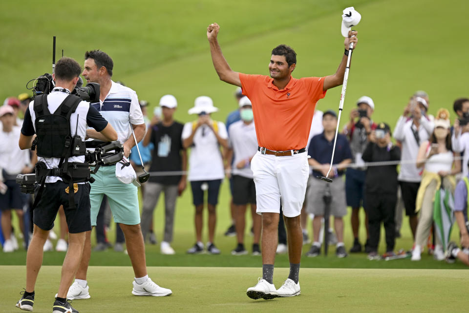 Eugenio Lopez-Chacarra from Spain reacts after winning the LIV Golf Invitational Bangkok 2022 at Stonehill Golf Club in Pathum Thani, Thailand, Sunday, Oct. 9, 2022. (AP Photo/Kittinun Rodsupan)