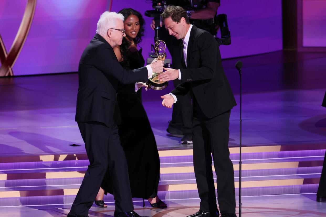 Ebon Moss-Bachrach takes his Emmy from Steve Martin