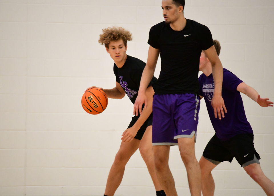 North graduate Cameron Gehlhausen (left) has walked onto the UE men's basketball team.