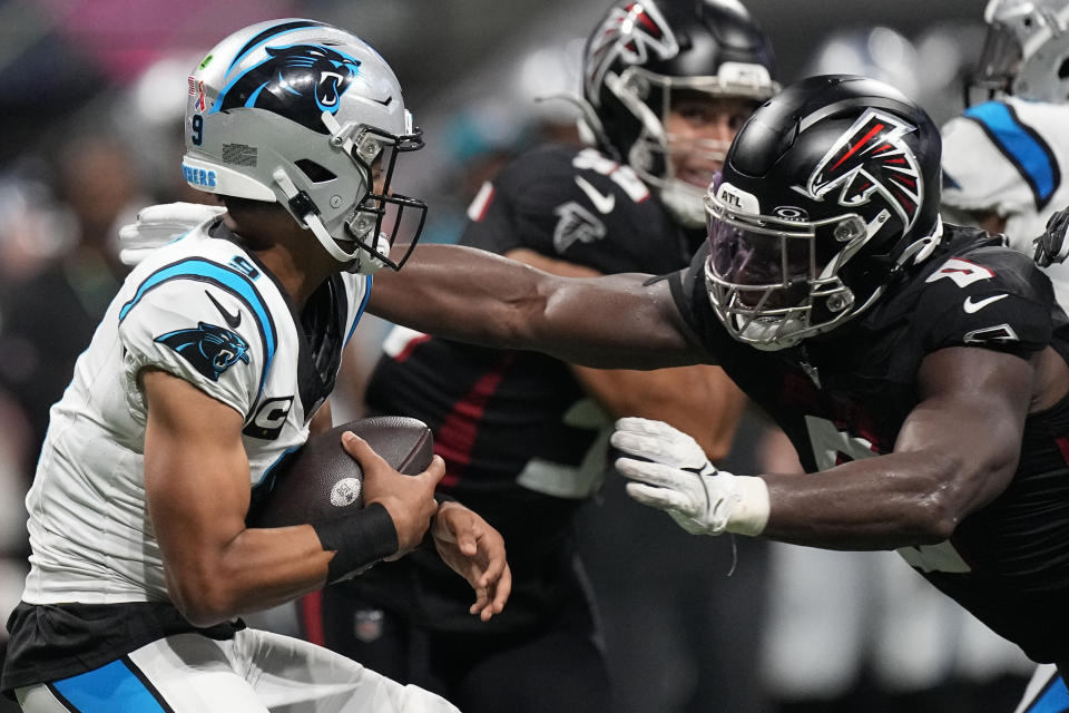 Atlanta Falcons linebacker Lorenzo Carter (0) sacks Carolina Panthers quarterback Bryce Young (9) during the second half of an NFL football game, Sunday, Sept. 10, 2023, in Atlanta. (AP Photo/John Bazemore)