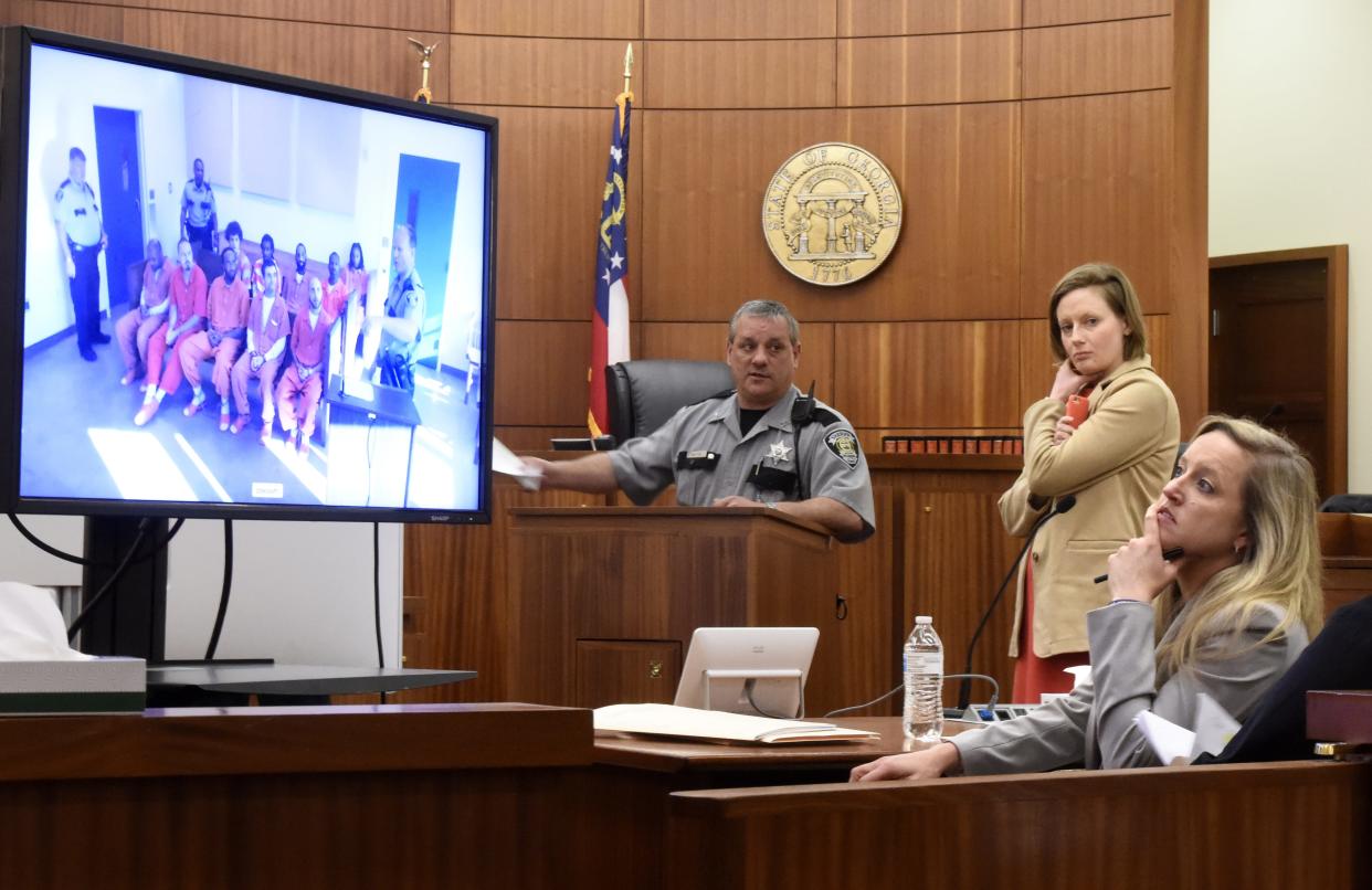 From a courtroom at the Augusta Judicial Center, then-District Attorney Natalie Paine, from right, and defense attorney Kelly Williamson watched a video of defendants at the Charles B. Webster Detention Center before the start of their arraignments at a Richmond County Courtroom in Augusta, Ga., Friday morning March 20, 2020.