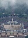 <p>Spitfires of the Battle of Britain Memorial Flight fly over the ceremony.</p>