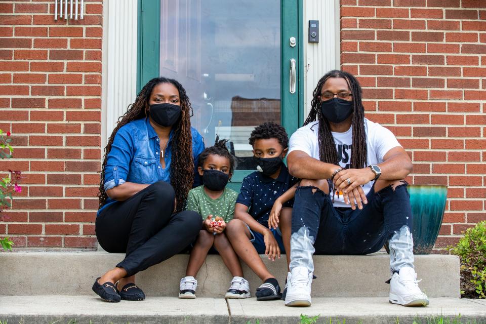 Tina and Nate Johnson of Colerain with their sons Arrison, 3, and Asten, 6. The sons were denied enrollment at Zion Temple Christian Academy because of their hairstyles. Asten was a student at the private school last year. Photo shot  Friday August 14, 2020. 