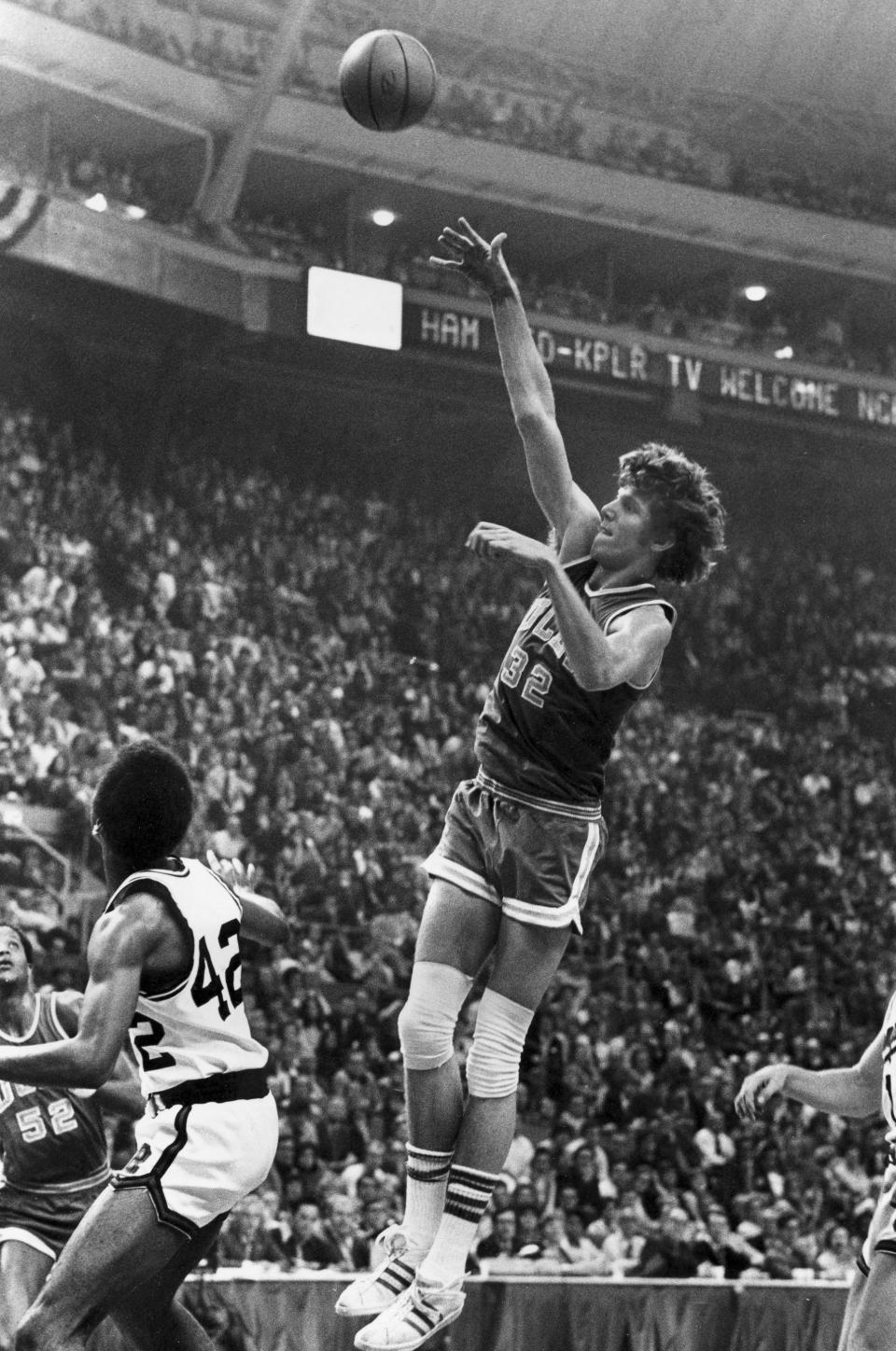 FILE - UCLA center Bill Walton (32) shoots for two of his record 44 points against Memphis State in final game of the NCAA basketball tournament in St. Louis, Mo., March 26, 1973. (AP Photo, File)