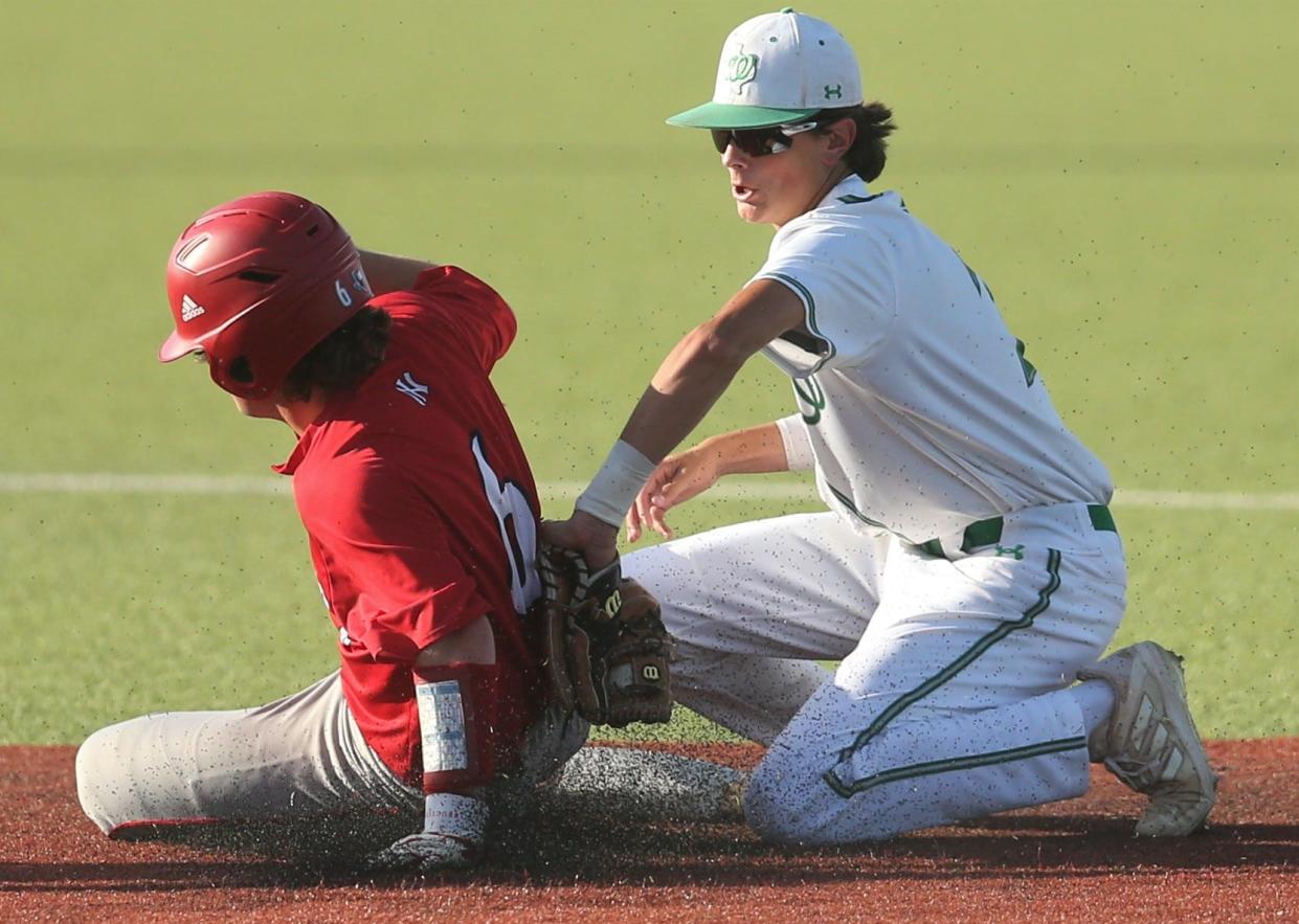 Jim Ned High School's Luke Vinson gets thrown out at second base as Wall's Augden Hallmark tags him during the District 6-3A championship at Angelo State University's Foster Field at 1st Community Credit Union Stadium on Monday, May 2, 2022.