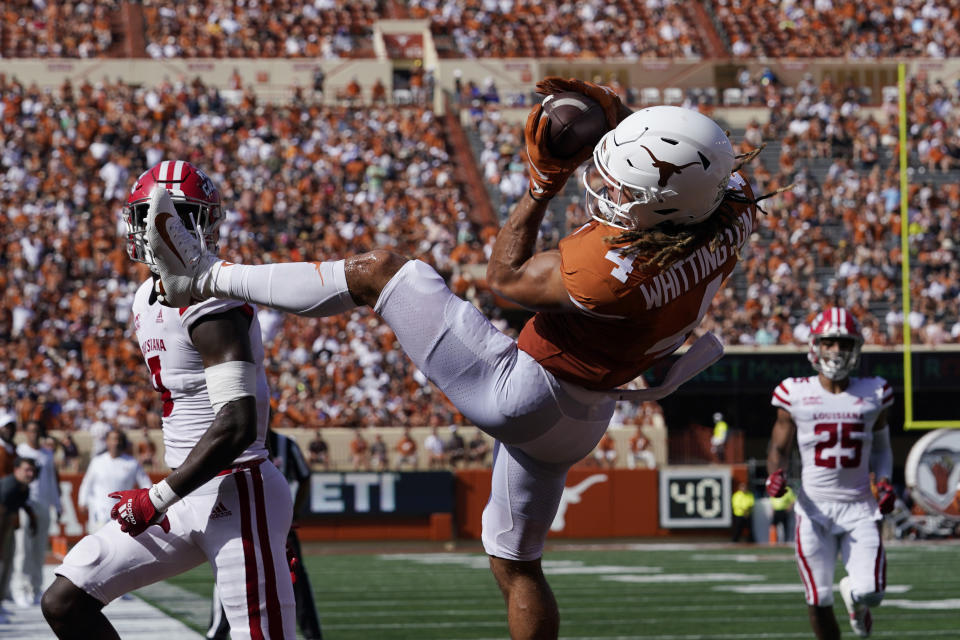 Texas wide receiver Jordan Whittington (4) pulls in a pass against Louisiana-Lafayette but lands out of bounds during the first half of an NCAA college football game Saturday, Sept. 4, 2021, in Austin, Texas. (AP Photo/Eric Gay)