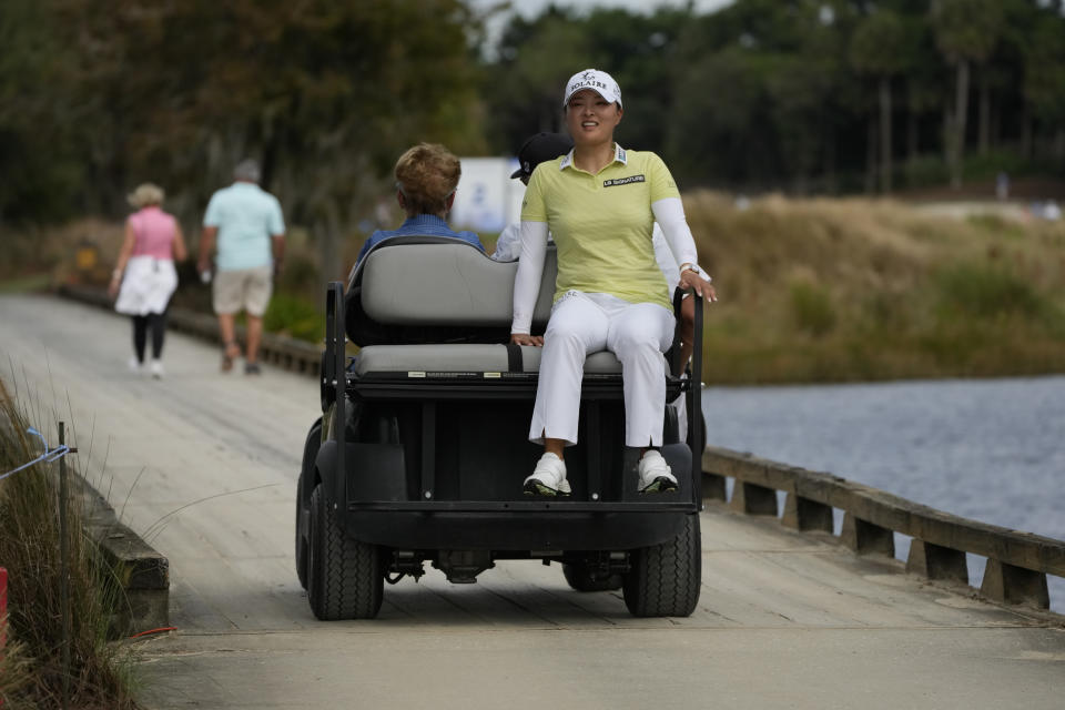 Jin Young Ko of South Korea, rides on a golf cart between the first and second holes, during the third round of the LPGA Tour Championship golf tournament, Saturday, Nov. 20, 2021, in Naples, Fla. (AP Photo/Rebecca Blackwell)