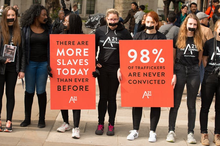 <span class="caption">A protest rally in London raises awareness for the fight against human trafficking and slavery.</span> <span class="attribution"><span class="source">John Gomez/Shutterstock.com</span></span>