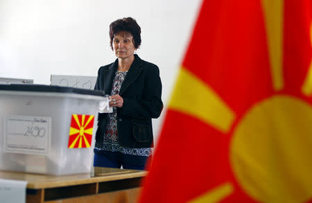 A woman casts her ballot for the presidential elections in Skopje, North Macedonia April 21, 2019. REUTERS/Ognen Teofilovski