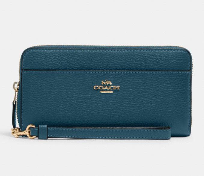 Accordion Zip Wallet With Wristlet Strap. Image via Coach Outlet.