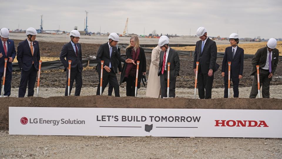 Jennifer Dahlgren, department manager for North American corporate communications at Honda, directs officials to their shovels Tuesday before the formal official groundbreaking for a new electric battery manufacturing plant near Jeffersonville in Fayette County. The L-H Battery Co. plant being built there is a joint venture between Honda and LG Energy Solution.