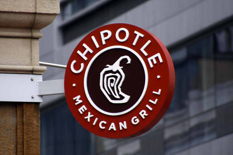 FILE - In this Feb. 8, 2016, file photo, shows a sign for the Chipotle restaurant in Pittsburgh's Market Square. Chipotle shares, under siege after a series of food scares erupted just over a year ago, are surging before the opening bell Wednesday, Sept. 7, after activist investor Bill Ackman revealed that he's become the taco chain's second largest investor. (AP Photo/Keith Srakocic, File)