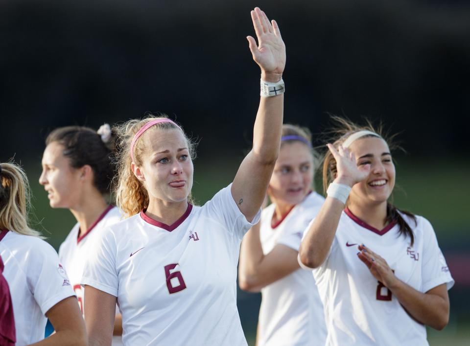 Florida State Seminoles Jaelin Howell (6) fights back tears as she waves to fans. Florida State defeated Michigan 1-0 after going into overtime in the NCAA quarterfinals on Friday, Nov. 26, 2021.