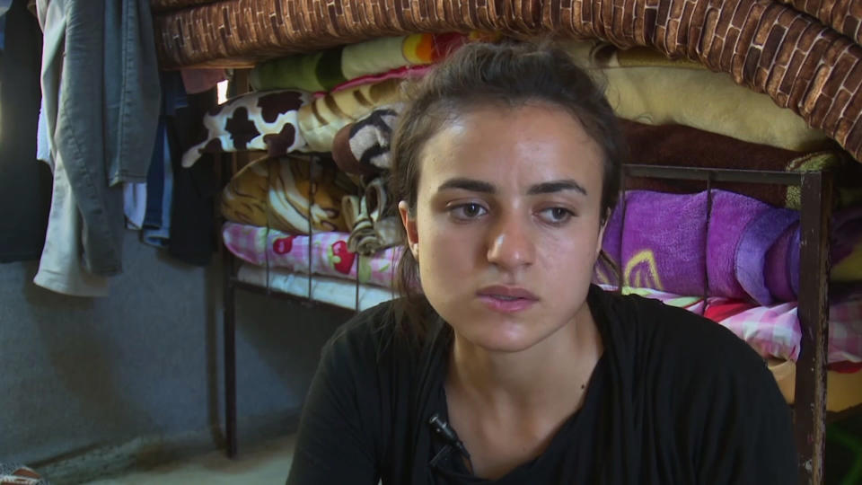 19-year-old Yazidi refugee, Ashwaq Haji Hami talks about her experiences in Germany, saying she has now returned to her homeland of Iraq for fear that her alleged Islamic State tormentor could harm her in Germany, during an interview at Essian refugee camp in Iraq, Friday Aug. 17, 2018. Hami says she was enslaved by Islamic State militants in 2014, but escaped and went to Germany where she ran into her captors again, so has emigrated to Iraq for safety. German prosecutors said Saturday Aug. 18, they are taking Ashwaq Haji Hami's claims seriously, but say they need more information to identify him. (AP Photo)