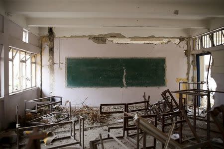 A view shows a damaged classroom inside a school that was run by UNICEF in the rebel-controlled area of Jobar, a suburb of Damascus, Syria March 2, 2016. REUTERS/Bassam Khabieh