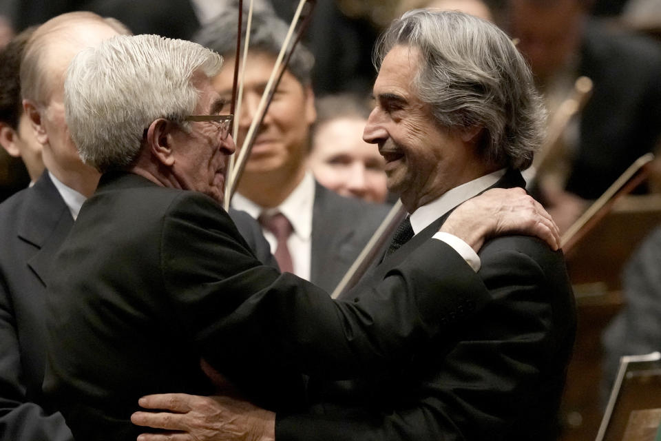 Riccardo Muti, musical director of the Chicago Symphony Orchestra, right, embraces Chicago Symphony Chorus Guest Director Donald Palumbo, after Muti conducted the orchestra and chorus in Beethoven's "Missa Solemnis" in D Major, Op. 123, Sunday, June 25, 2023, in Chicago. Sunday marked the last performance by Muti, 81, in Orchestra Hall during his 13 year tenure. (AP Photo/Charles Rex Arbogast)