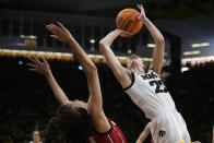 Georgia forward Brittney Smith, left, is fouled by Iowa guard Caitlin Clark (22) in the second half of a second-round college basketball game in the NCAA Tournament, Sunday, March 19, 2023, in Iowa City, Iowa. (AP Photo/Charlie Neibergall)