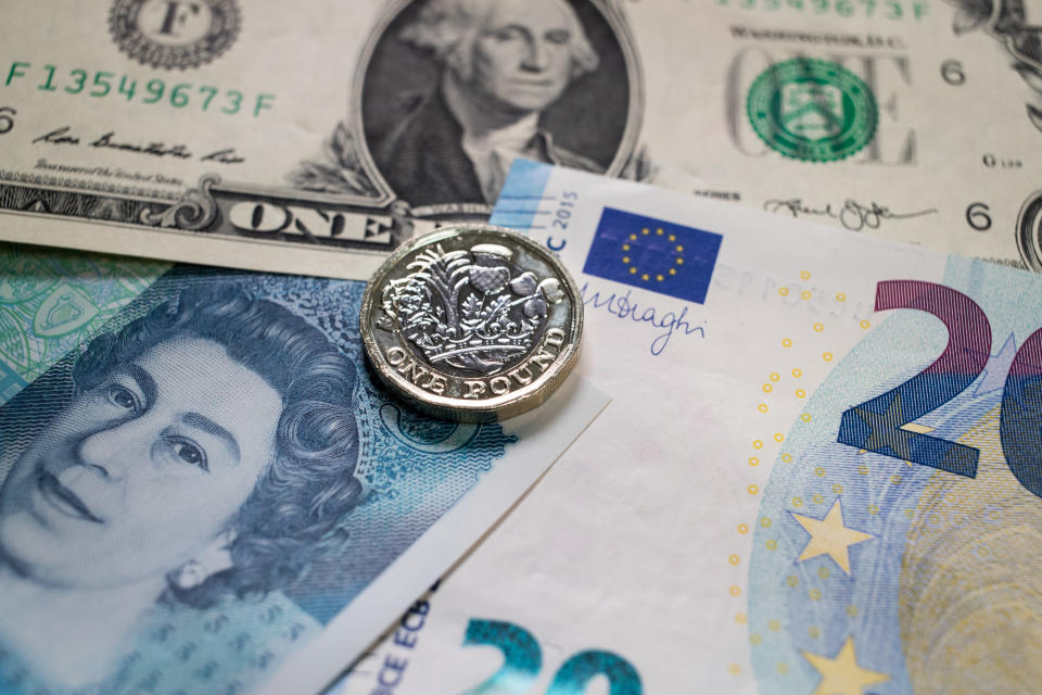 BATH, ENGLAND - APRIL 04:  The new £1 pound coin is seen alongside US dollar bills and euro notes on April 4, 2017 in Bath, England.  Currency experts have warned that as the uncertainty surrounding Brexit continues, the value of the British pound, which has remained depressed against the US dollar and the euro since the UK voted to leave in the EU referendum, is likely to fluctuate.  (Photo by Matt Cardy/Getty Images)