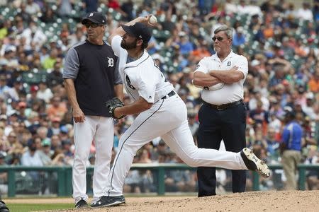 Aug 24, 2017; Detroit, MI, USA; Detroit Tigers manager Brad Ausmus (7) and trainer Kevin Rand look on as starting pitcher Michael Fulmer (32) throws a pitch during the fifth inning against the New York Yankees at Comerica Park. Mandatory Credit: Rick Osentoski-USA TODAY Sports