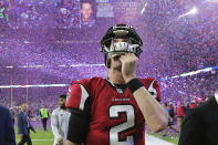 FILE - In this Feb. 5, 2017, file photo, , Atlanta Falcons quarterback Matt Ryan reacts after losing Super Bowl 51 as the screen flashes New England Patriots quarterback Tom Brady and confetti flies in Houston. As the World Series comes to Atlanta for the first time since 1999, there is hope that the city — once immortalized by Sports Illustrated as “Loserville” — and the entire state of Georgia, for that matter, could be taking a turn toward some long-overdue parades and celebrations. (Curtis Compton/Atlanta Journal-Constitution via AP, File)