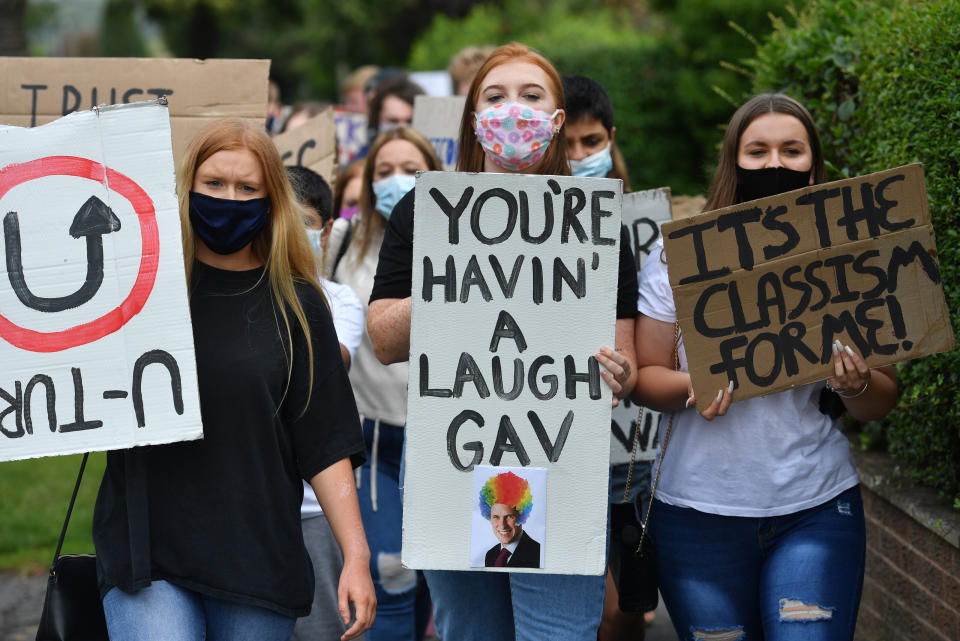 Students from Codsall Community High School march to the constituency office of their local MP Gavin Williamson, who is also the Education Secretary, as a protest over the continuing issues of last week's A level results which saw some candidates receive lower-than-expected grades after their exams were cancelled as a result of coronavirus. (Photo by Jacob King/PA Images via Getty Images)