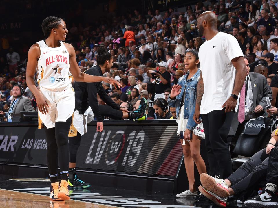 Kobe and Gigi Bryant (right) greet Nneka Ogwumike (left) at the 2019 WNBA All-Star Game.