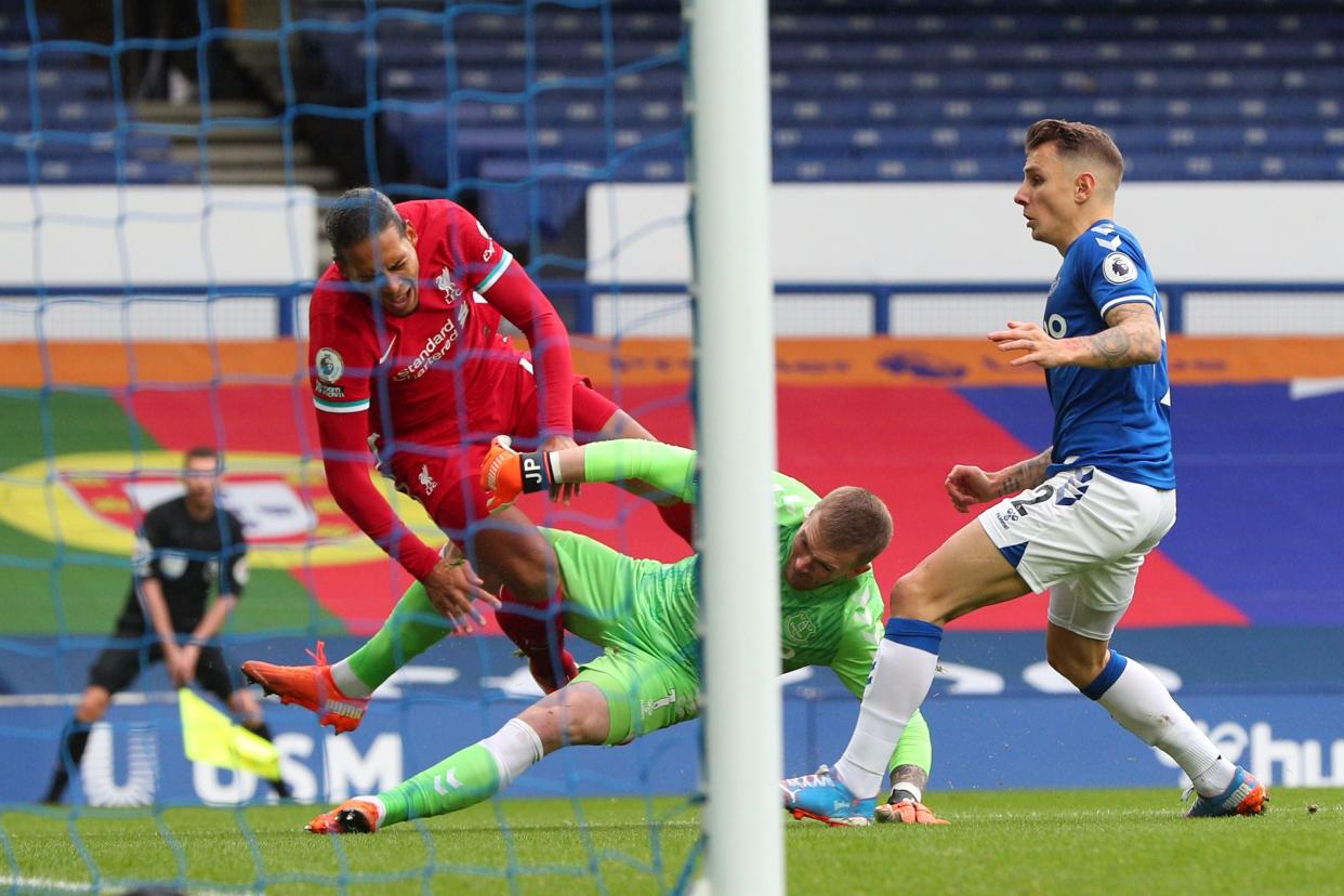 Jordan Pickford is under fire following his tackle on Virgil van Dijk that has left the Liverpool defender requiring surgery (Getty)