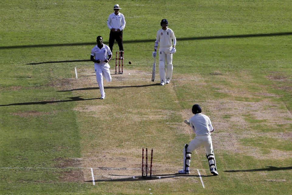 England's James Anderson, bottom, is bowled by West Indies' Shannon Gabriel during day one of the second Test cricket match at the Sir Vivian Richards Stadium in North Sound, Antigua and Barbuda, Thursday, Jan. 31, 2019. (AP Photo/Ricardo Mazalan)