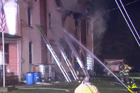 Firefighters work on the scene of a house fire Wednesday, Dec. 7, 2022, in West Penn Township, west of Allentown, Pa. Pennsylvania State Police say two firefighters died responding to the blaze where a body was found, while two people who lived in the home got out safely. (WFMZ-TV via AP)