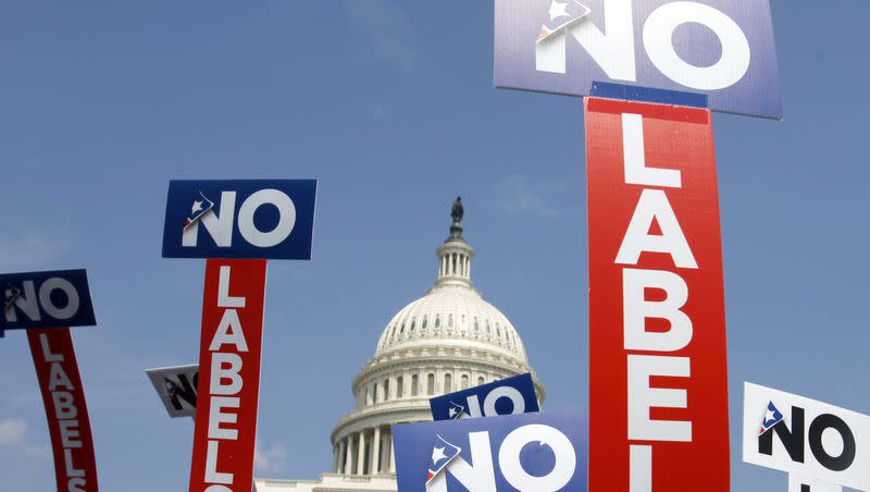 People with the group No Labels hold signs during a rally on Capitol Hill in Washington on July 18, 2011. The No Labels movement has talked about offering a third-party candidate for president next year.