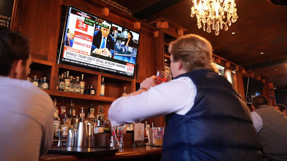 Patrons at the Hawk and Dove bar watch the news after former President Donald Trump was found guilty on all 34 counts in his criminal trial on May 30, in Washington, DC. - Andrew Harnik/Getty Images