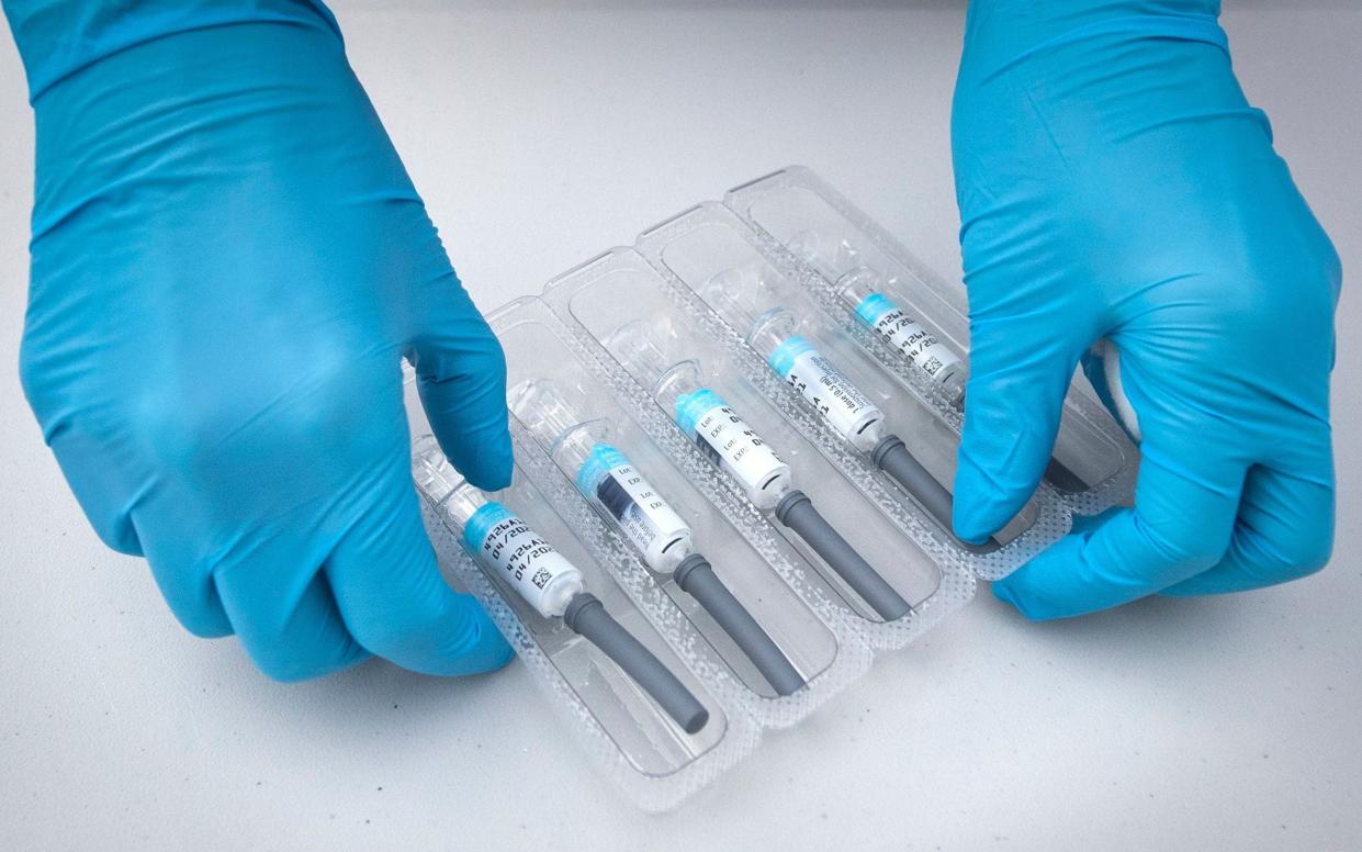 Flu vaccines are prepared at a drive-through centre in Scotland - Jane Barlow/PA