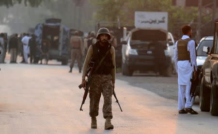 A soldier returns to the staging area after participating in a security operation on the outskirts of Peshawar, Pakistan June 24, 2017. REUTERS/Fayaz Aziz