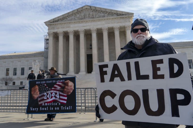 People demonstrate outside the U.S. Supreme Court in Washington Thursday as oral arguments were heard on whether former President Donald Trump can remain on Colorado's Republican Primary ballot for the 2024 election. Photo by Bonnie Cash/UPI