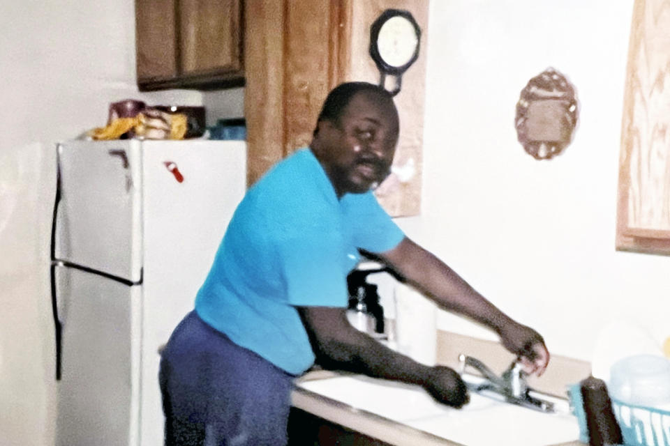 In this family photo, Carl Grant prepares to cook in the home he shared with his partner, Ronda Hernandez, in Redlands, Calif., circa 2000. Grant’s death was among more than 1,000 across the United States that an investigation led by The Associated Press documented after police used “less-lethal force” instead of firearms. (Ronda Hernandez via AP)